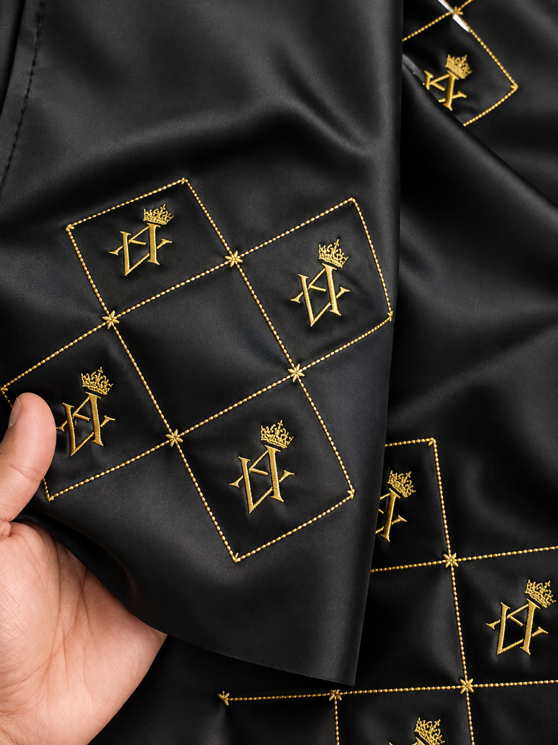 Black fabric gold embroidered crown monogram lining